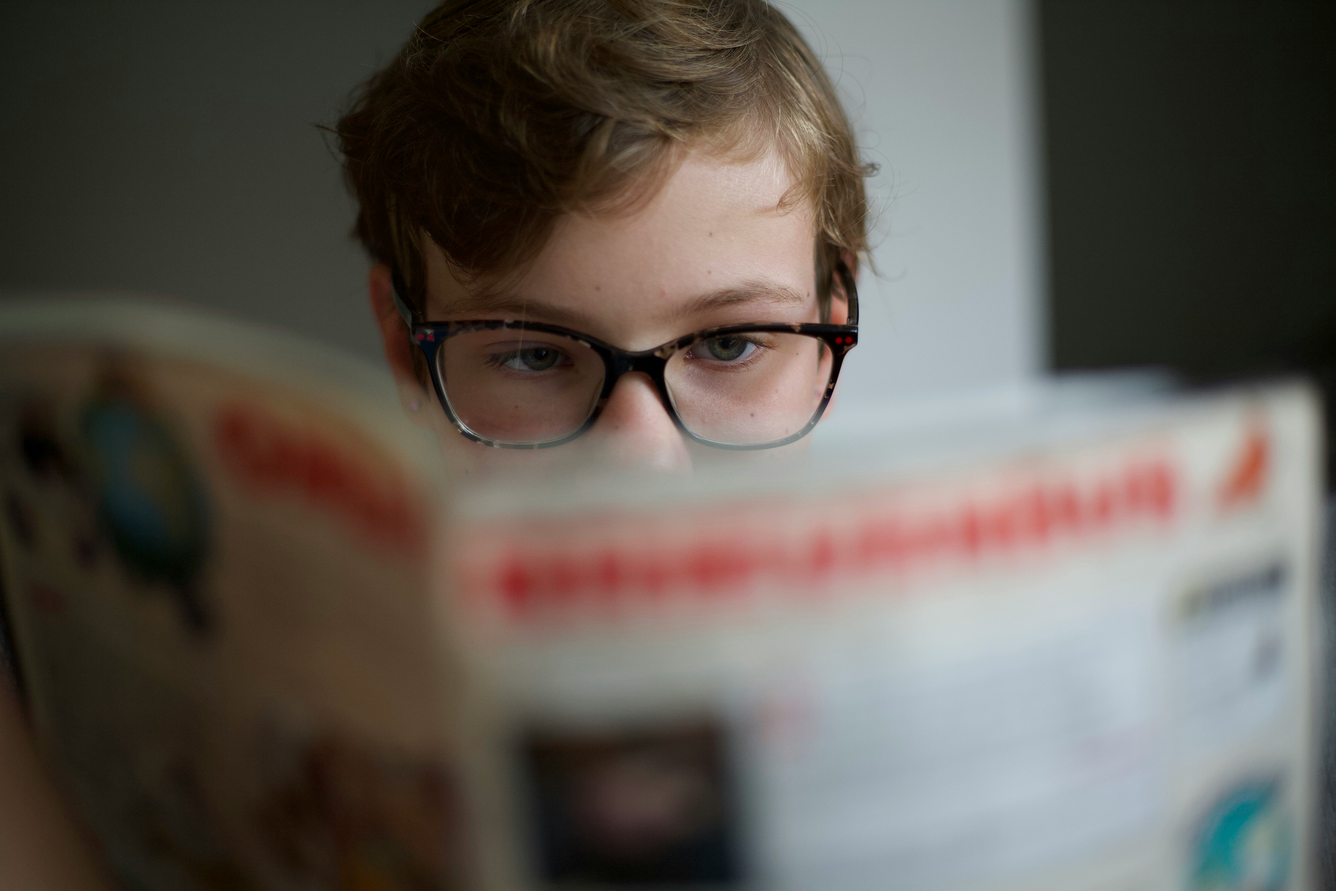 Child concentrating while reading